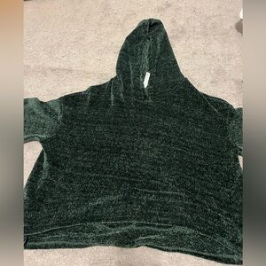 Dark green cropped sweater with hood.